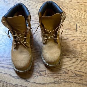 Size 7M Timberland boots worn by 12 year old, but very infrequently.